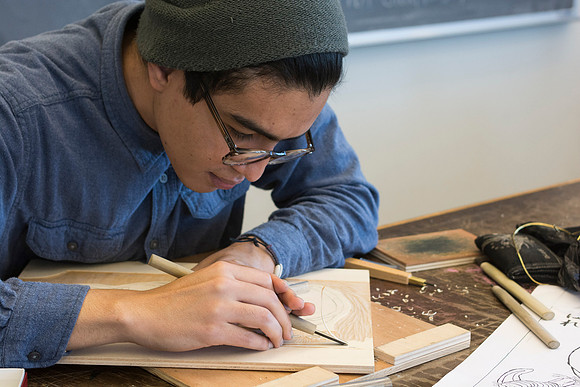 Art students at work in their hands-on print making class.