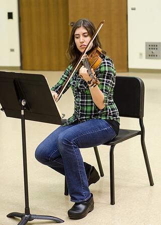A member of the Shanghai String Quartet working with student ensembles.