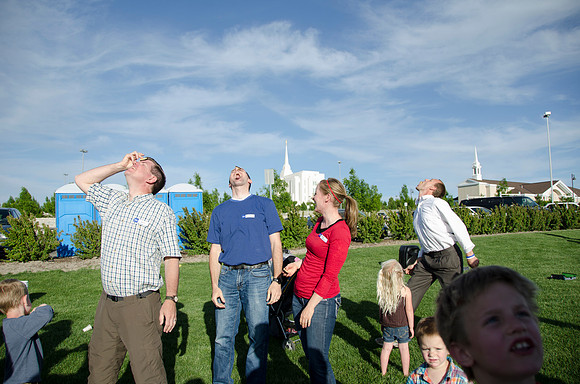 Online instructors gather with their families for an eveing of BBQ and games.