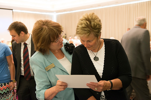 Alumni of the class of 1964 and earlier gather and honor the Briggs for their service.