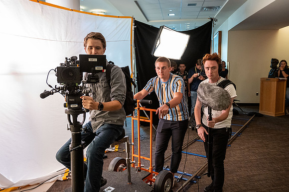 Video production in I-Center. Recreating students going to devotional.