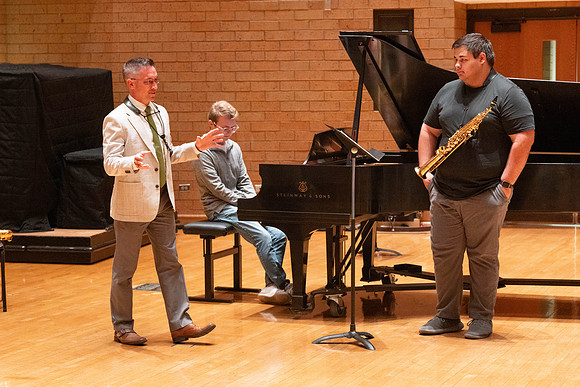 Members of the United States Marine Band work with students in a Masters class.