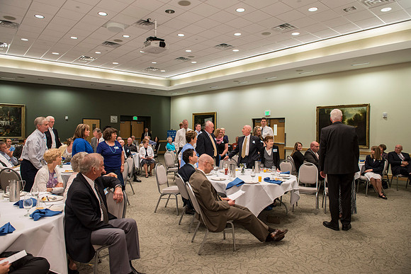 Alumni of the class of 1964 and earlier gather and honor Kay and Cheryl Briggs with the Alumni Award of Excellence for their service.
