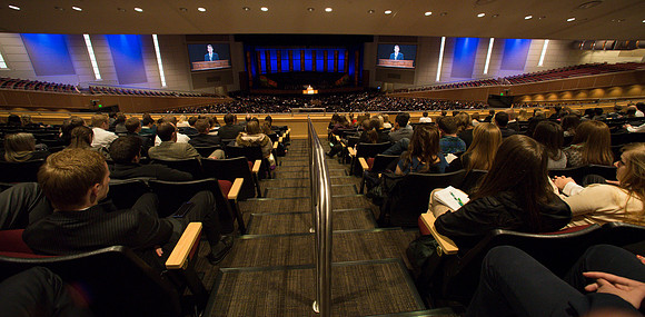 Students listen and take notes to Randal L. Ridd during the World Wide Devotional