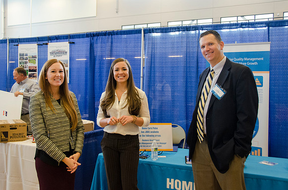 BYU-Idaho students speak to representatives from colleges or companies from their field of study at a career fair held in the I-Center gym