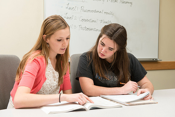 Teacher Education students offer their services tutoring kids 3rd grade to 12th grade. Melody Eliason tutoring Nicole Swain.