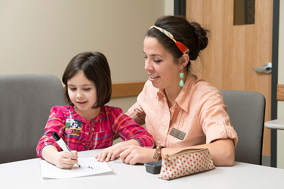 Teacher Education students offer their services tutoring kids 3rd grade to 12th grade. Kim Argueta tutoring Jenna Davis.