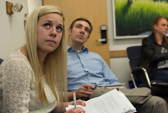 Students look up at the projector to copy down notes in Brother Clay's Social Psychology class.