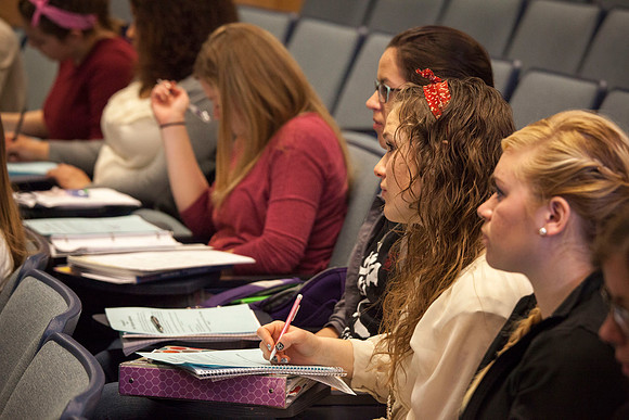 Students listen to Brother Madsen as he teaches in his early morning Geography class.