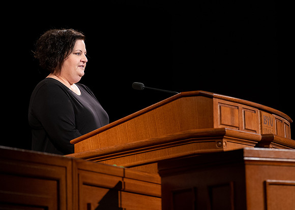 Sister Jacquel Fluckiger giving a talk during devotional.