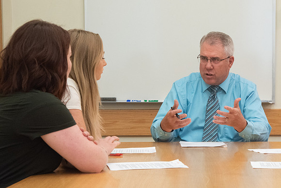 Instructor Brent Bean teaching Communication class.