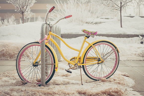 The winter frost settles on a bicycle next to the David O. McKay library.