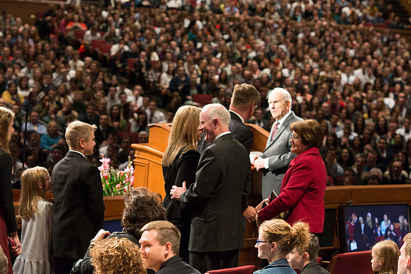 Brigham Young University-Idaho's newest President of the University, Clark Gilbert, walks up to the podium with his family and are greeted by President Kim B. Clark, Sue Clark and Russell M. Nelson. P
