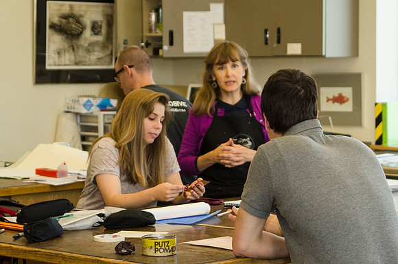 Students in Sister Jimison's Printmaking class share ideas during class in the Spori Building.