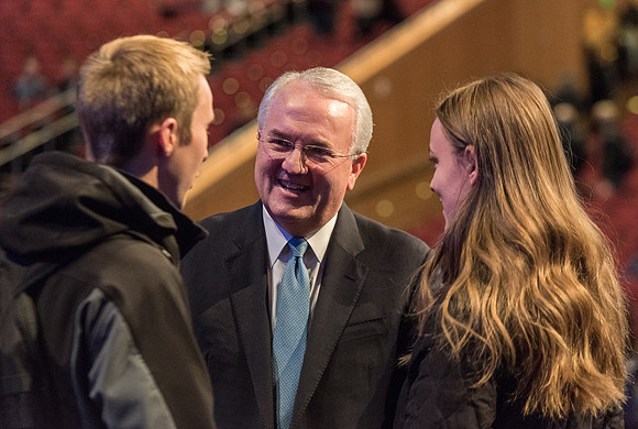 Elder Gerard talking with students after devotional.