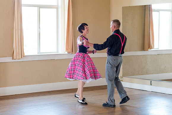 Adam and Jennifer Anderson dancing at the Woodman Ballroom for Online Recruiting marketing material.