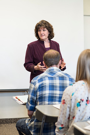 Sister Brooke McKenna teaches students in a communication class.
