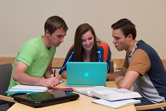 Students engage in an active study group for the new housing promo pictures.