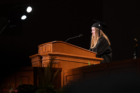 Ashlee Pulliam, Child Development major, gives invocation at convocation for the College of Education & Human Development - opening prayer