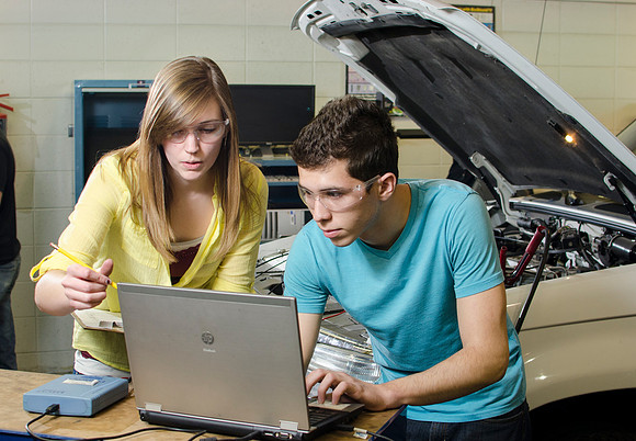 Automotive students get real practical expeience working on cars during lab time.