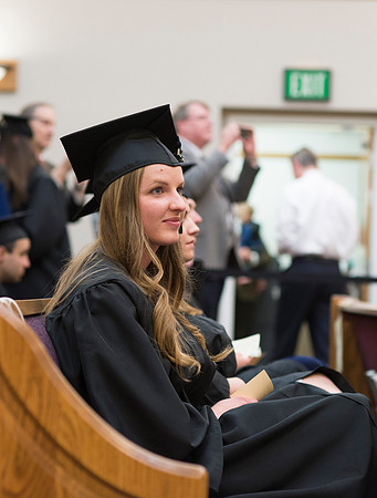 Students of the College of Human Development wait to receive their diploma cover.