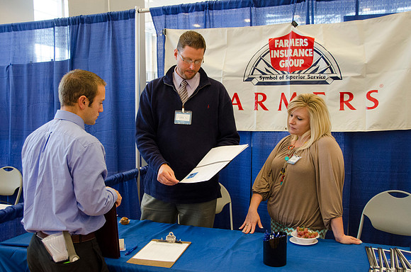 BYU-Idaho students speak to representatives from colleges or companies from their field of study at a career fair held in the I-Center gym