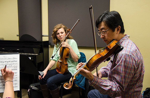 A member of the Shanghai String Quartet working with student ensembles.