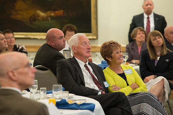 Alumni of the class of 1964 and earlier gather and honor Kay and Cheryl Briggs with the Alumni Award of Excellence for their service.
