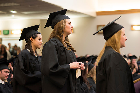 Students of the College of Human Development receive their diploma cover.