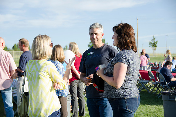 Online instructors gather with their families for an eveing of BBQ and games.