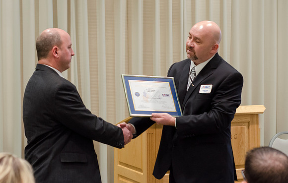 Todd Smith receiving an award on behalf of BYU-Idaho from the Office of the Secretary of Defense for the support BYU-Idaho has given to Peter Stilling while he has been serving in the Guard. Awarded b