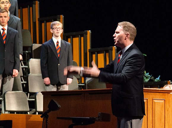 Men choir performing for devotional.