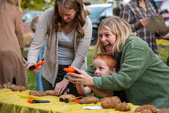The Rexburg community celebrating the harvest of the potatoes through different activities at the Rexburg Tabernacle.
