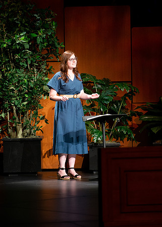 BYU-I student conducting a hymn during devotional.