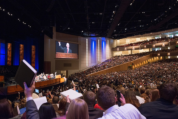 Students raise their scripture to show their readiness to learn.