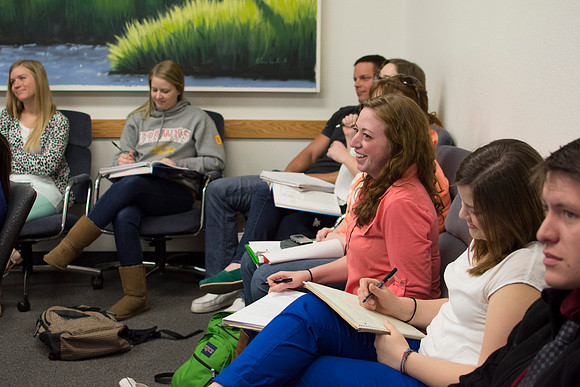 A student playfully reacts to a comment Brother Clay made during class.
