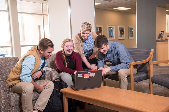 Information Technology students pose on campus for the department webpage.