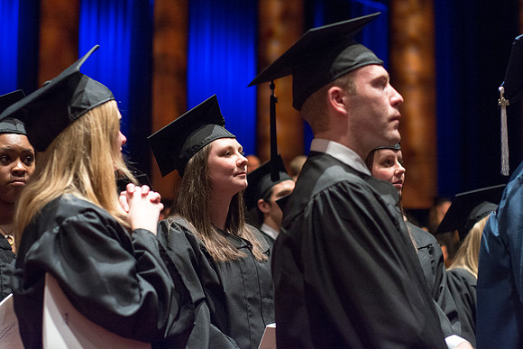Students show their appreciation to those who supported them throughout their education at the commencement ceremony. Photo by Ryan Chase