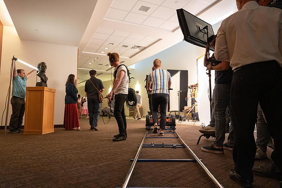 Video production in I-Center. Recreating students going to devotional.