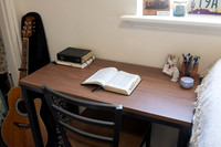 Scriptures on a desk in a clean student bedroom