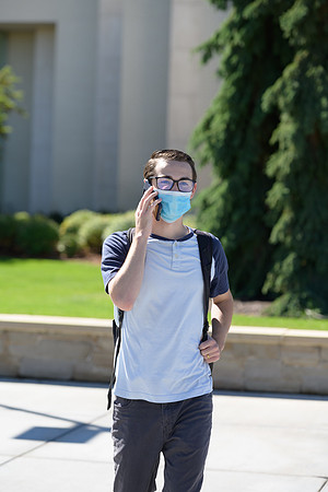 Student volunteers show the way to stay safe during this COVID 19 pandemic by social distancing, following pathway arrows and proper wearing of masks .