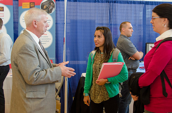 BYU-Idaho students speak to representatives from colleges or companies from their field of study at a career fair held in the I-Center gym
