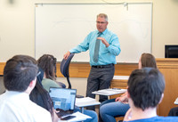Instructor Brent Bean teaching Communication class.