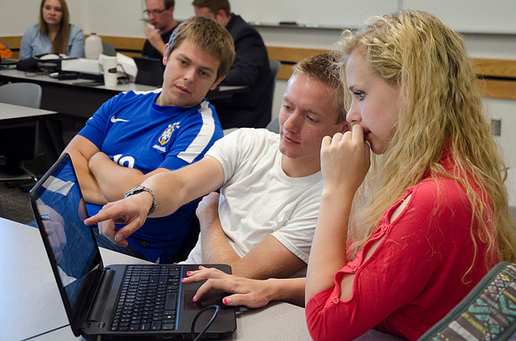 Students work together in a group project.