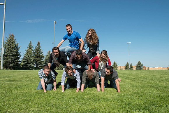 Student models interact and smile for marketing purposes that will be used for the new Campus Housing next to The Ivy.