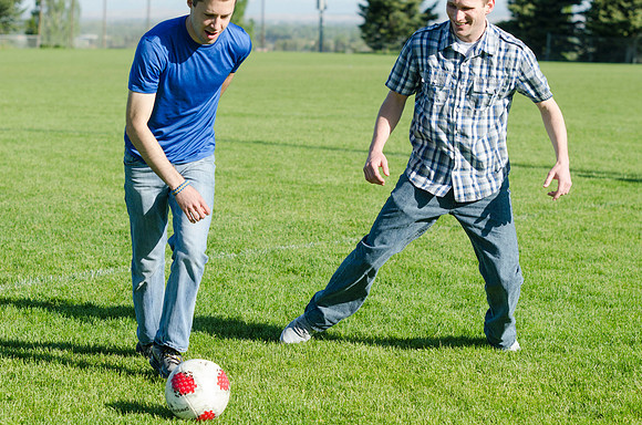 A group of students play a friendly game of soccer.
