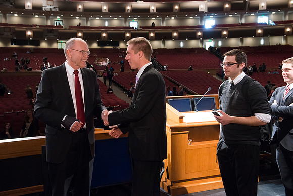 Russel T. Osguthorpe, the president of the the General sunday School, greets students and employees after devotional.
