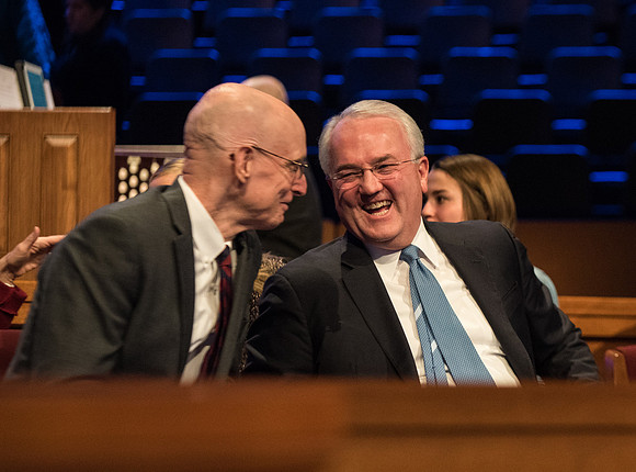 Elder Gerard and President Eyring talking after devotional.