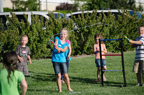 Online instructors gather with their families for an eveing of BBQ and games.