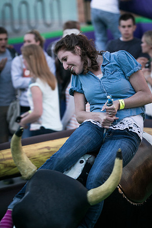 Students test their ability to stay on top of a mechanical bull during the BYU-Idaho i-Night Extavaganza.